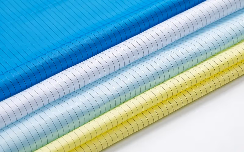 Rolls of striped ESD fabric in blue, white, green and yellow